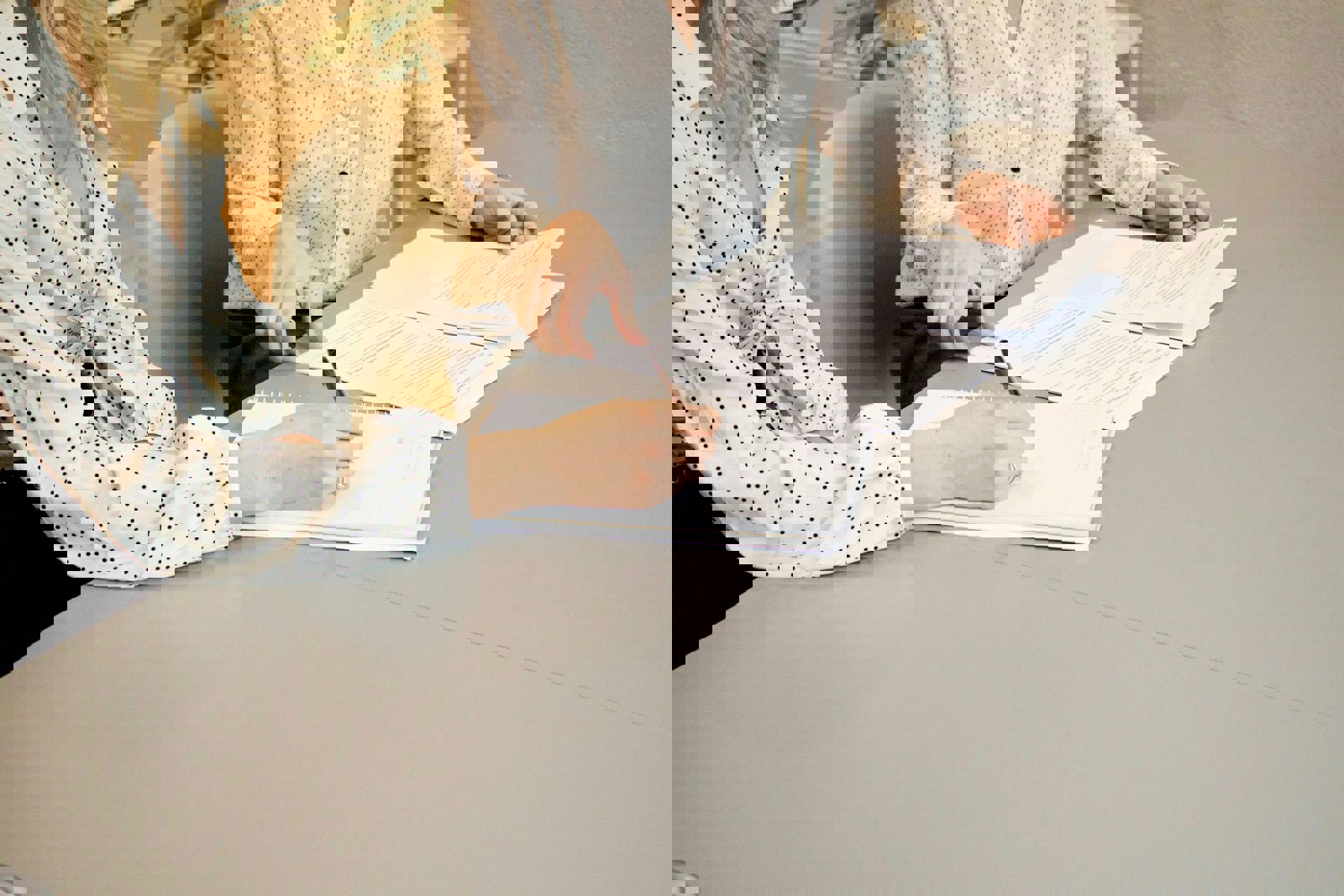 Tow people sorting paper documents